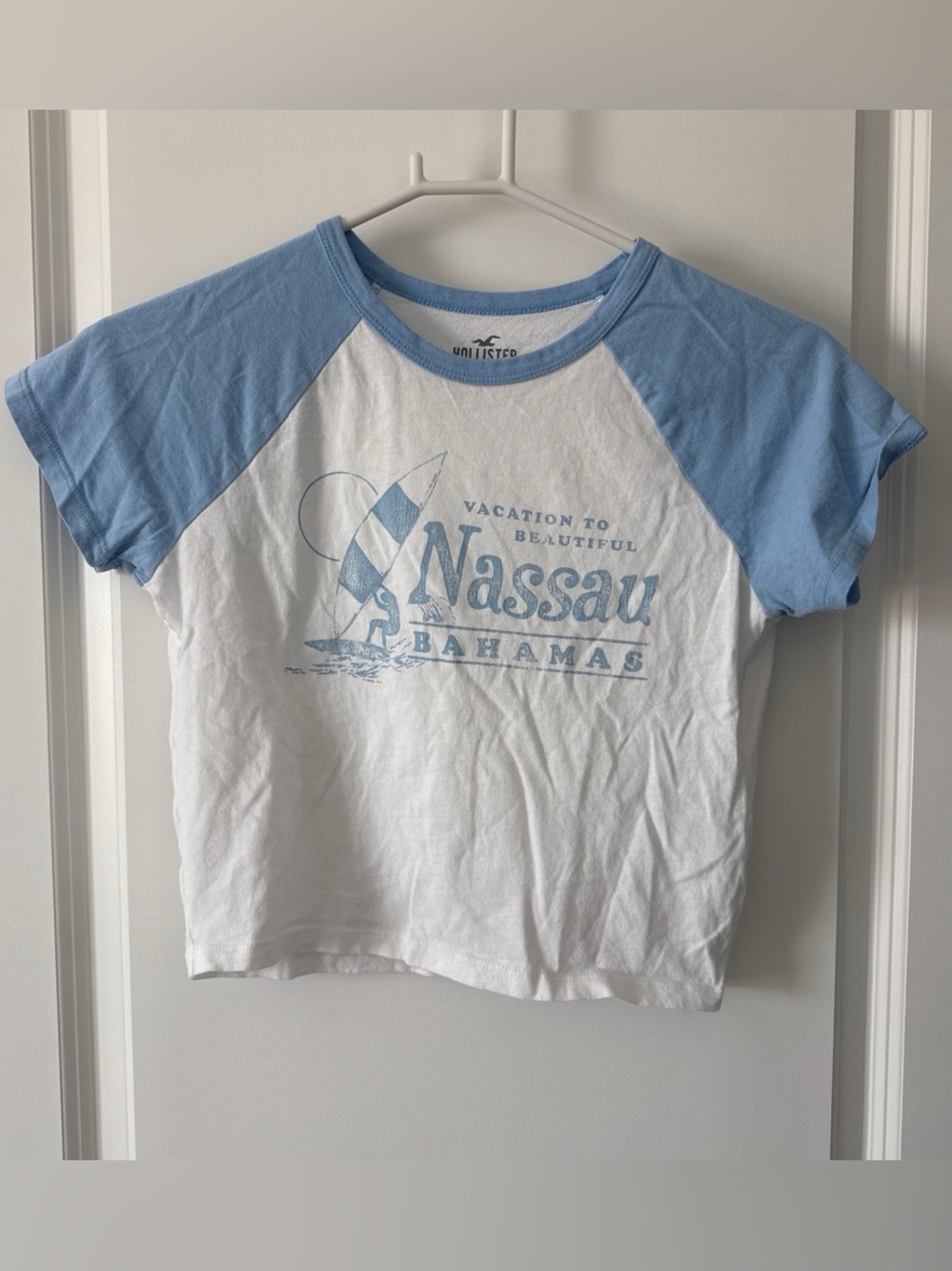 Hollister White Tee with Light Blue Raglan Sleeves & Nassau Graphic
